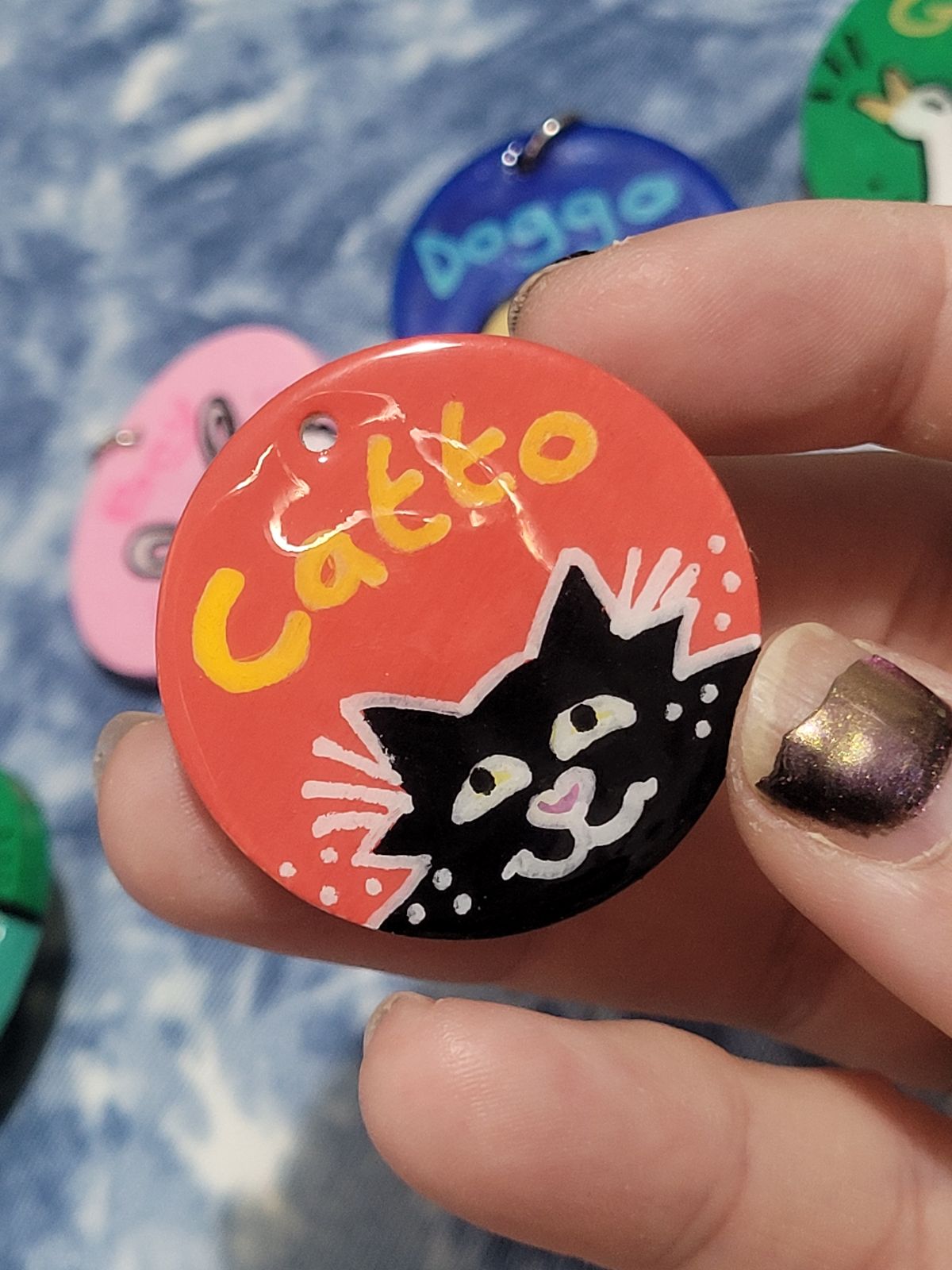 Cute black cat badge with 'Catto' written above.