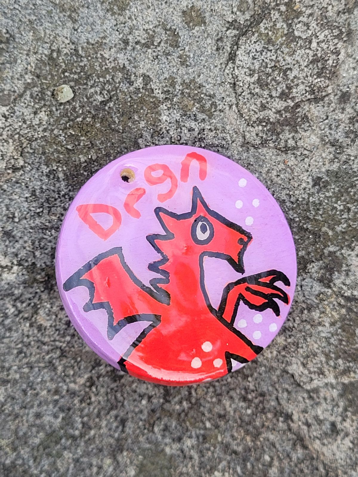 Cute cartoon red dragon with Drgn written above.