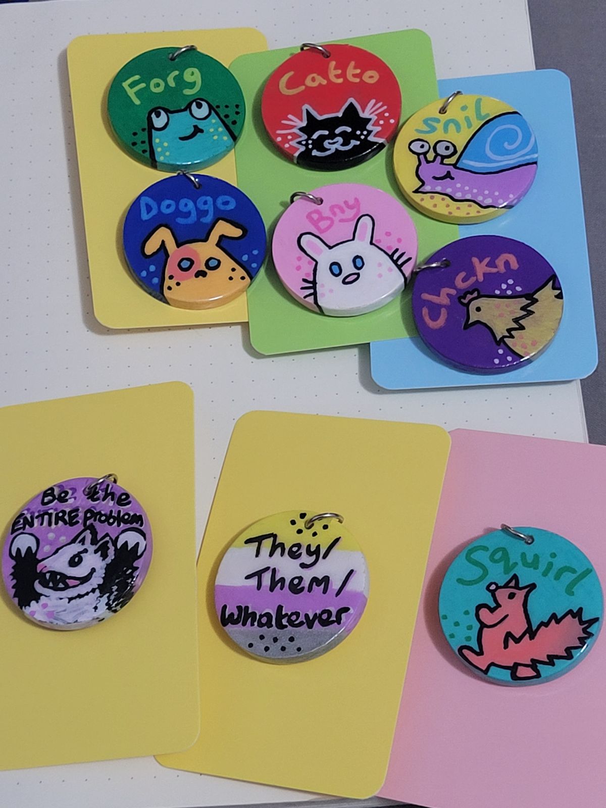 A selection of finished badges ready to be sent to gift recipients.