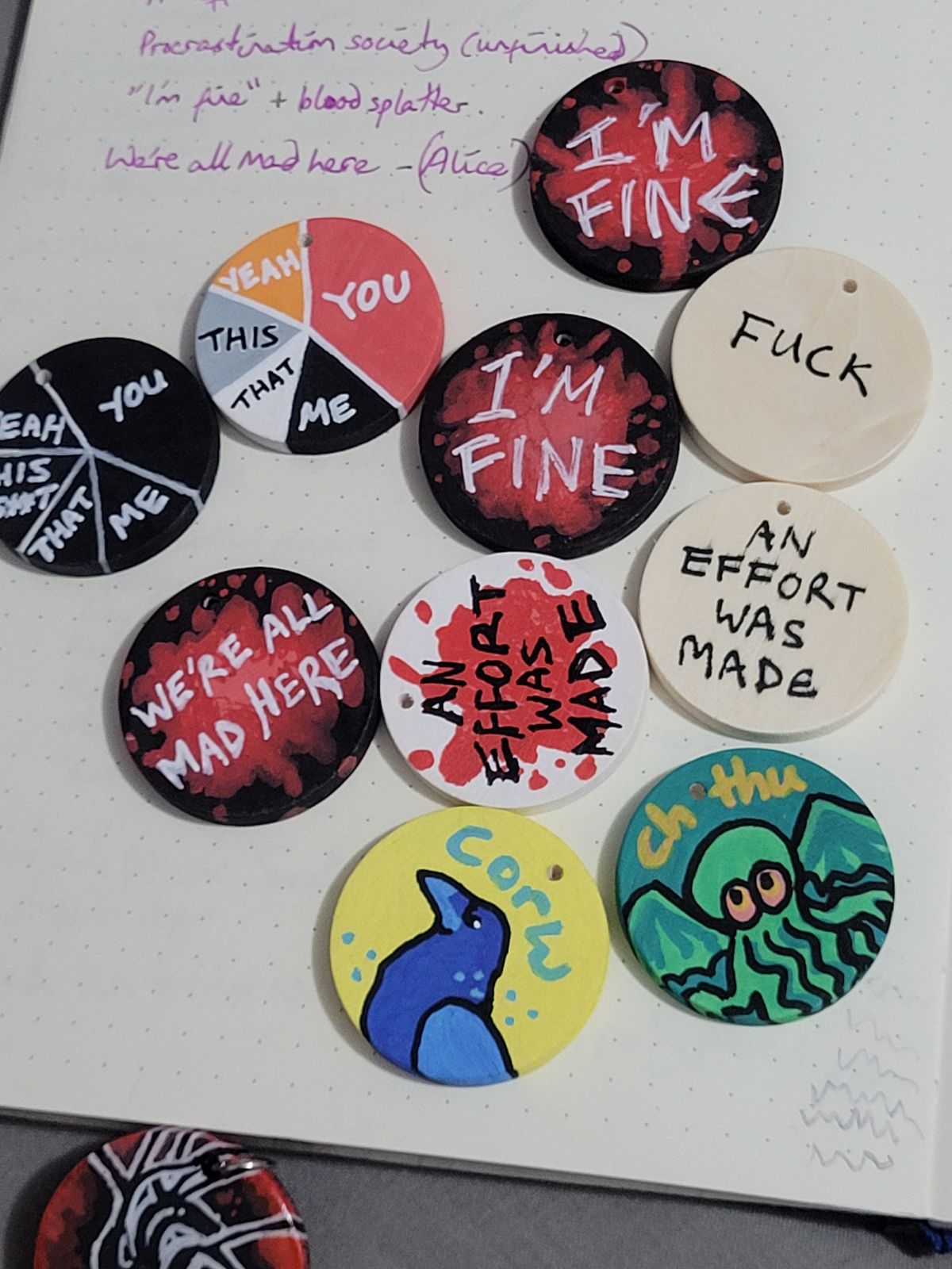 Text badges: 'I'M FINE', 'AN EFFORT WAS MADE', 'WE'RE ALL MAD HERE', 'FUCK', plus cartoon crow ('corw') and Cthulhu ('chthu').